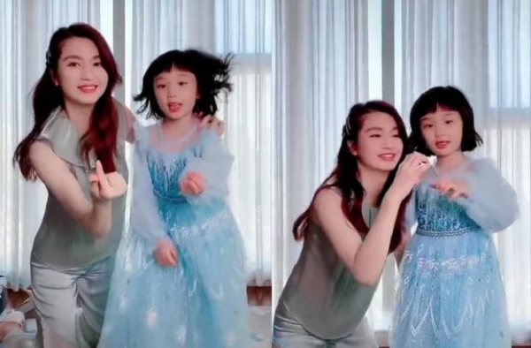 洪欣和女儿比心跳舞，女儿天生一张明星脸，穿公主裙太仙气